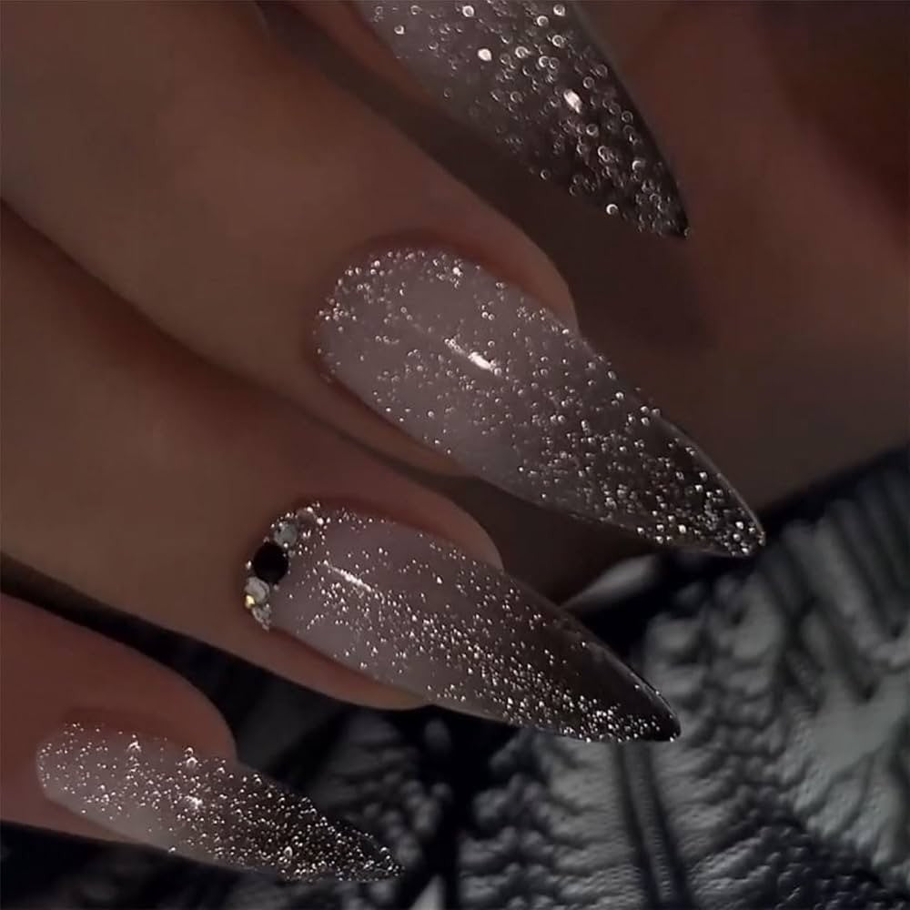 Hand wearing Black Ombré Glitter Stiletto press-on nails