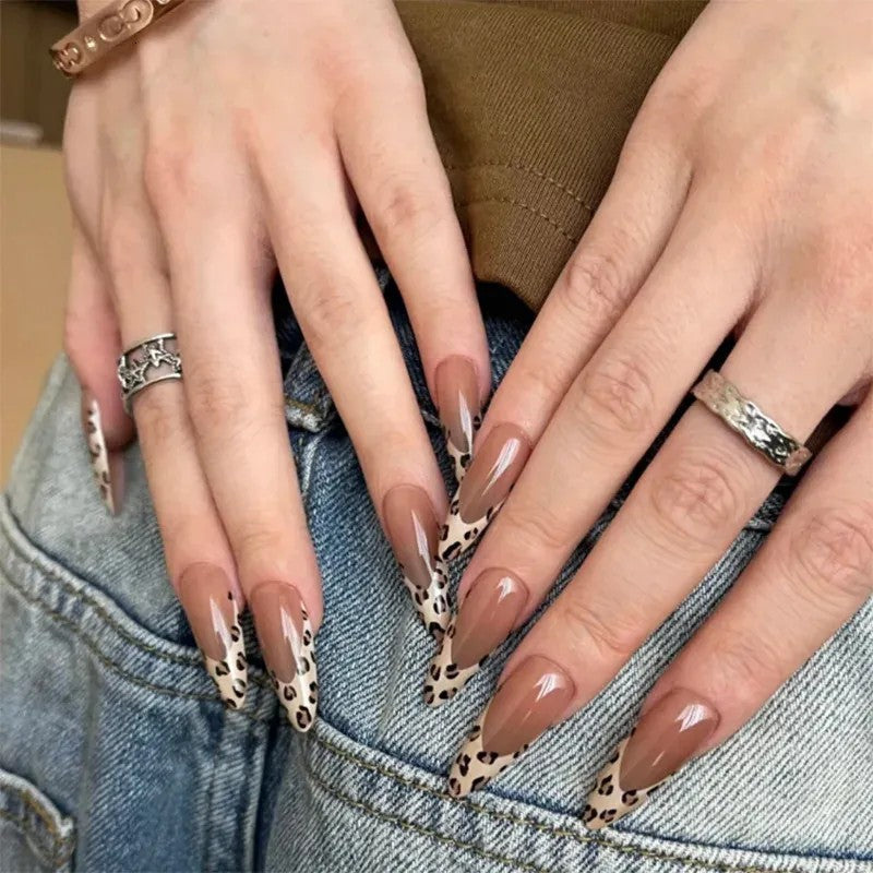 Hand wearing Leopard French Tip Almond press-on nails