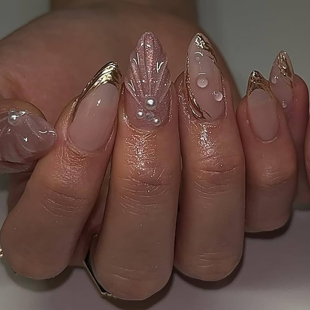Hand wearing Nude Pearl Seashell Almond press-on nails