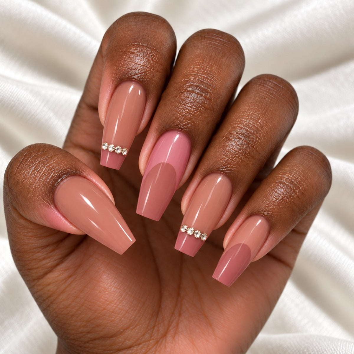 Hand wearing Nude Pink Coffin with Rhinestone Line press-on nails