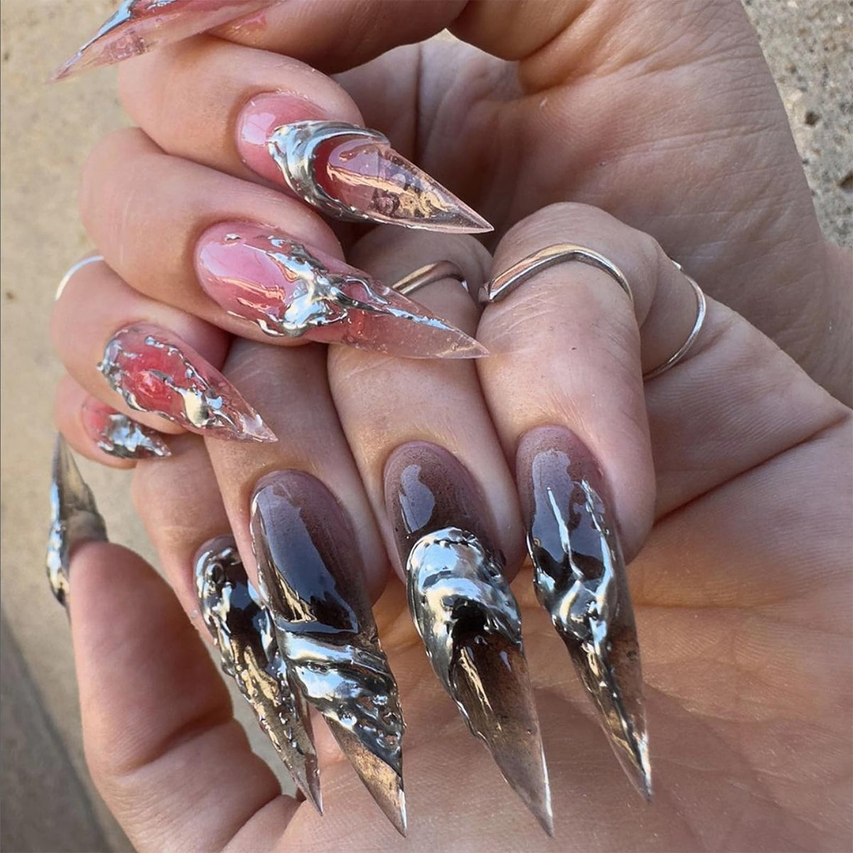 Hand wearing Pink & Silver Chrome Stiletto press-on nails
