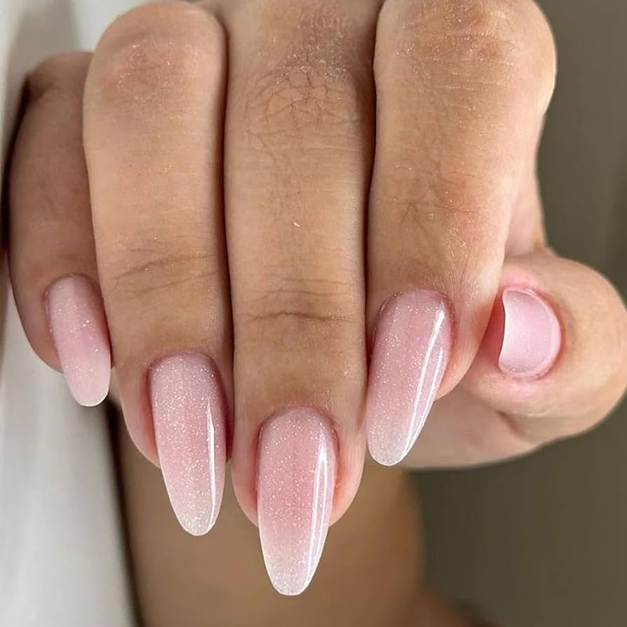 Hand wearing Pink Shimmer Almond press-on nails